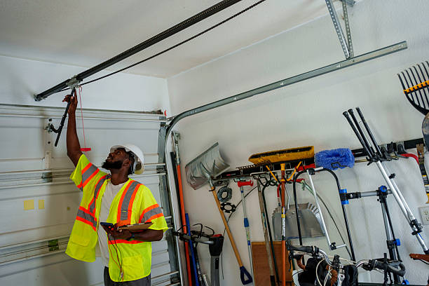 Professional Garage Door Panel Replacement technician working in Dimondale, MI